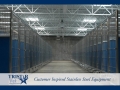 TriStar Vet kennel photo: A row of blue Starlite color panels warm up a large kennel floor plan